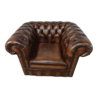 Brown leather chesterfield armchair