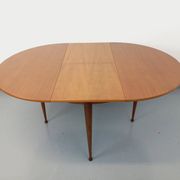 Round dining table in vintage Scandinavian style from the 50s and 60s in teak.