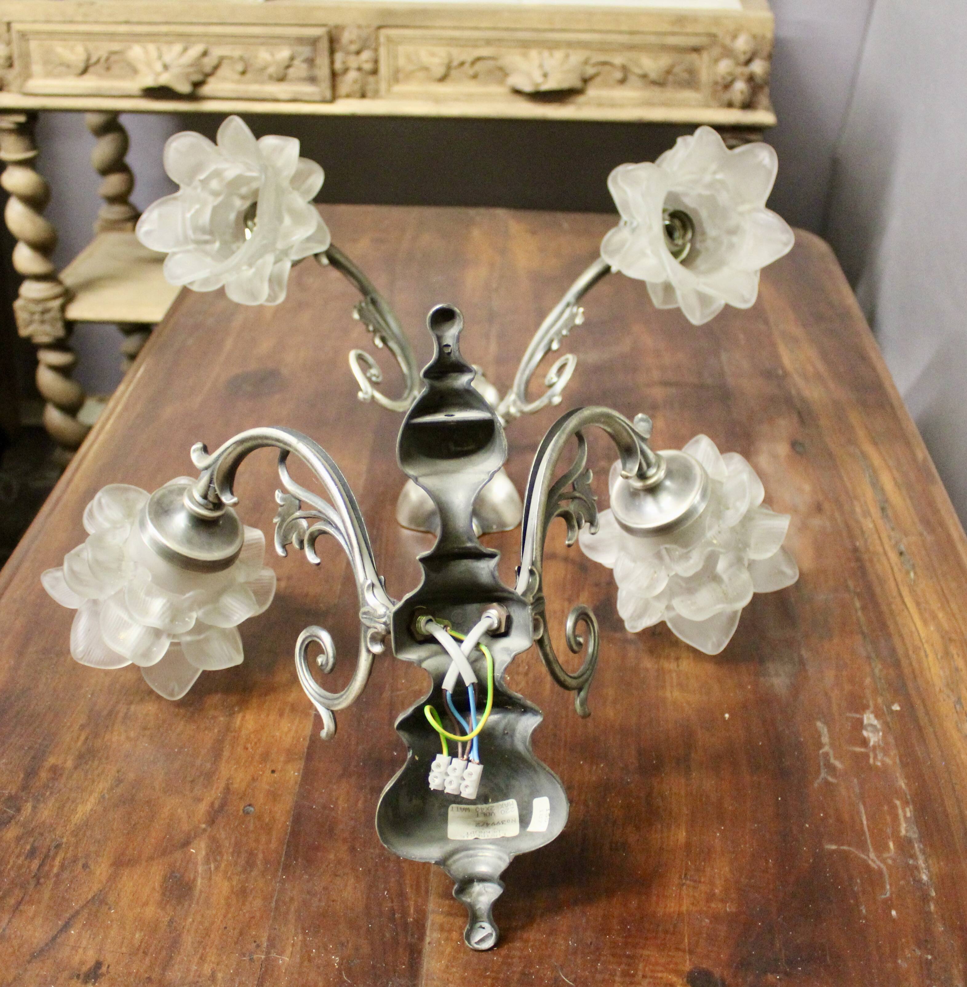 Pair of wall sconces with 2 light arms