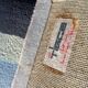 Tapis en laine noué main Tisca à motif géométrique, signé “ILES”, France, années 1990