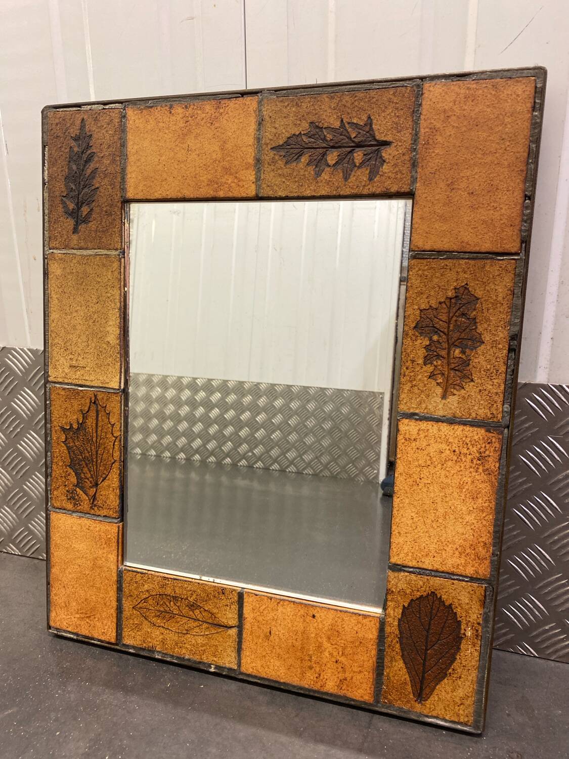 Ceramic wall mirror with herbarium decor circa 1960