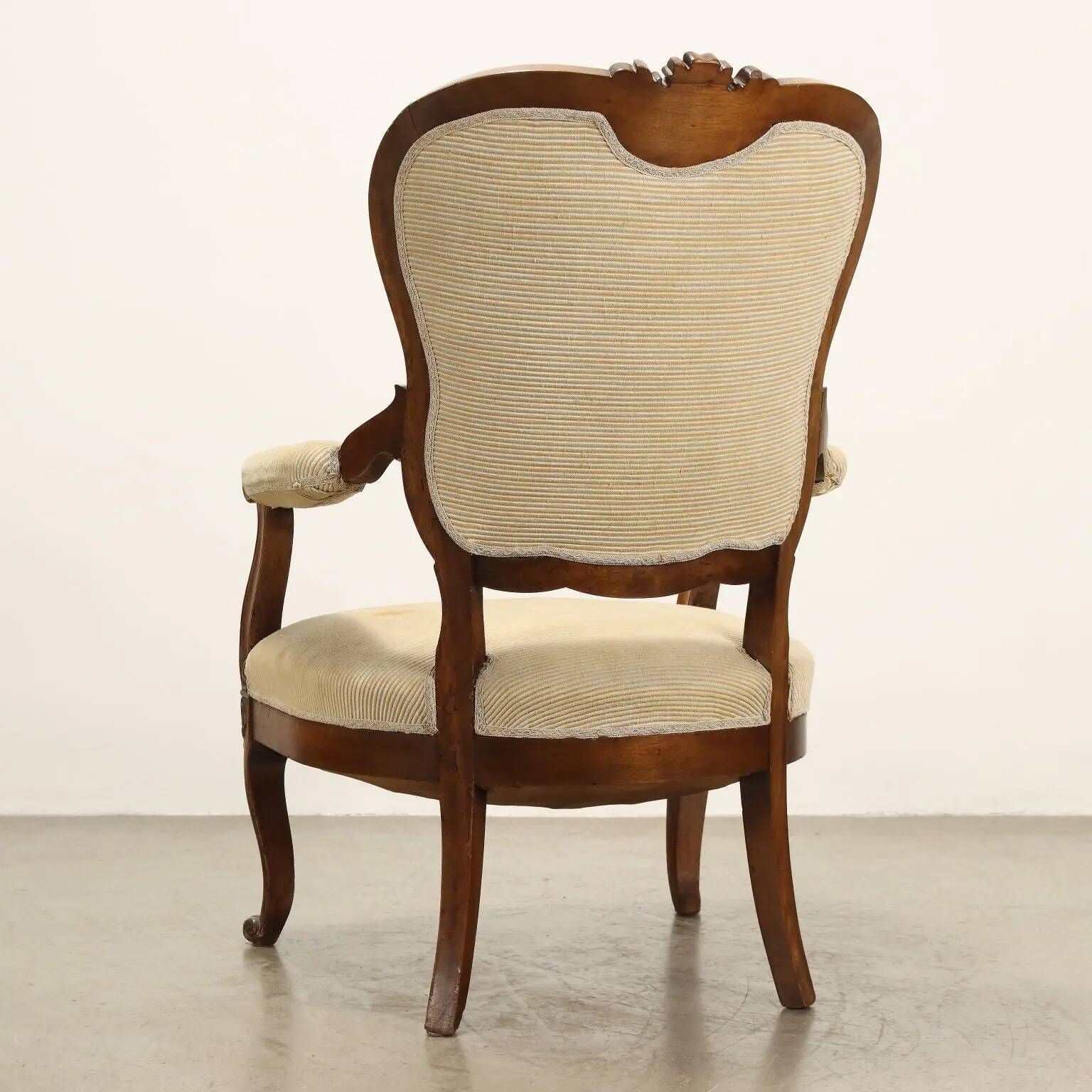 Antique Louis-Philippe armchair in carved walnut, Italy, 19th century