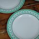 Set of 4 KIFO L'Amandinoise flat plates with green leaf design.