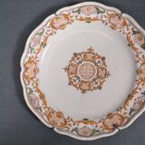 Two 18th century earthenware plates with grand feu decoration in ochre, green and manganese