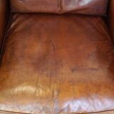 Comfortable Art Deco design armchair in cognac-colored sheepskin combined with wood