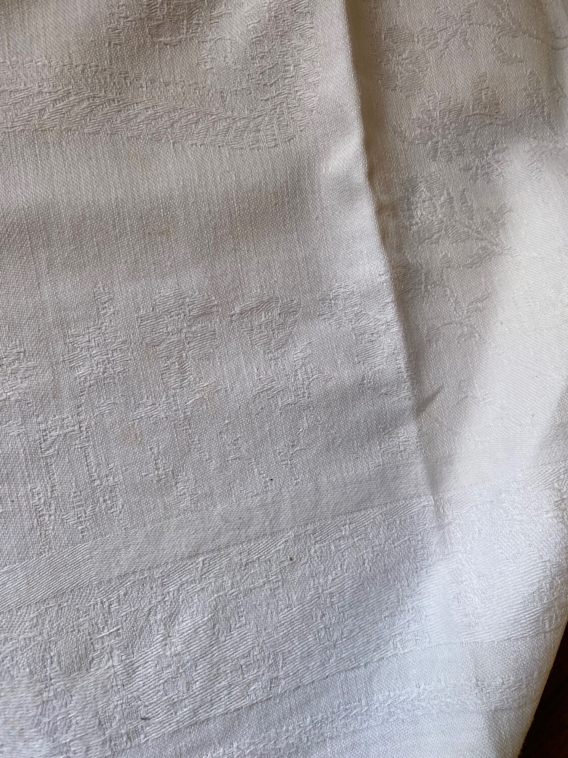 Pair of embroidered white cotton tea towels.