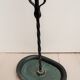 Wearing dark green metal 50s umbrella