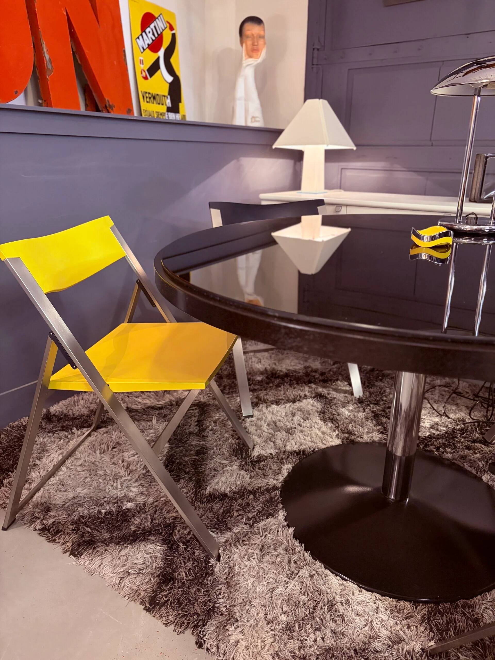 Round dining table, 1980s, black stained wood with glass top
