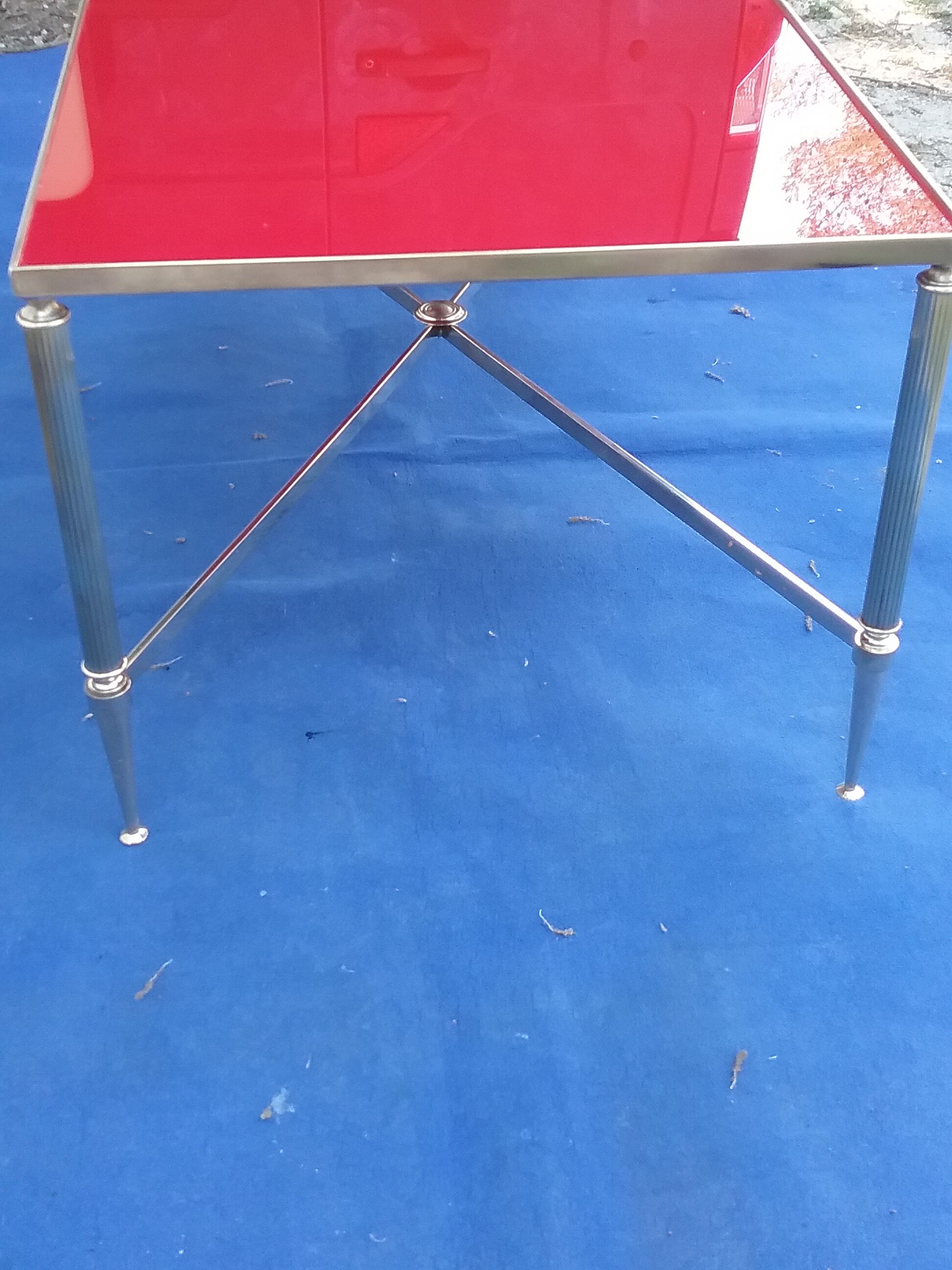 Brass coffee table with red glass top