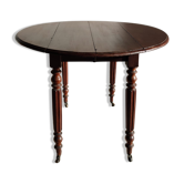 Circular mahogany dining table with two flaps XIXth