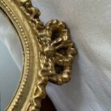 Oval wall mirror in baroque gilded plaster frame 29x20cm