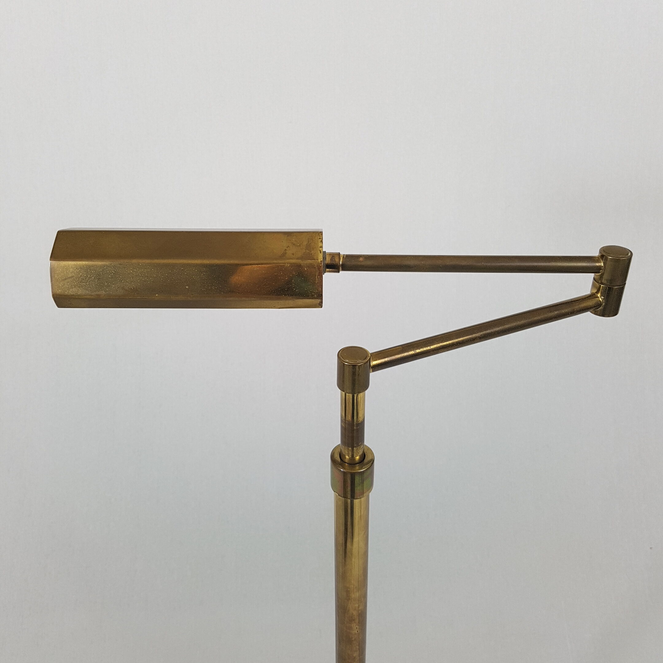 Articulated brass floor lamp