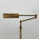 Articulated brass floor lamp
