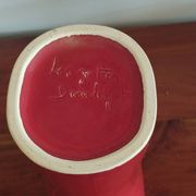 red ceramic designer vase by Les Grottes de Dieulefit
