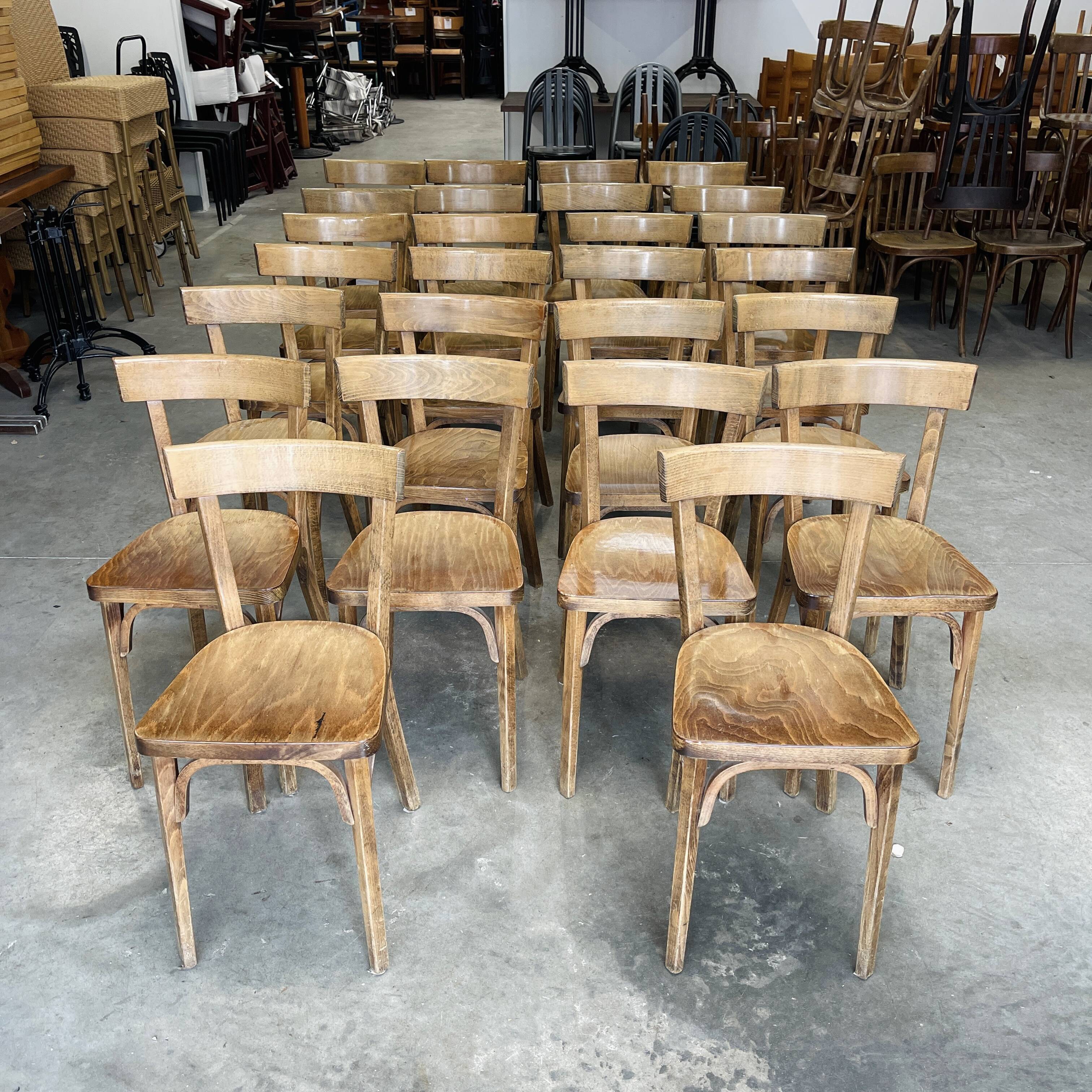 Set of 26 Baumann wooden bistro chairs from the 1950s France