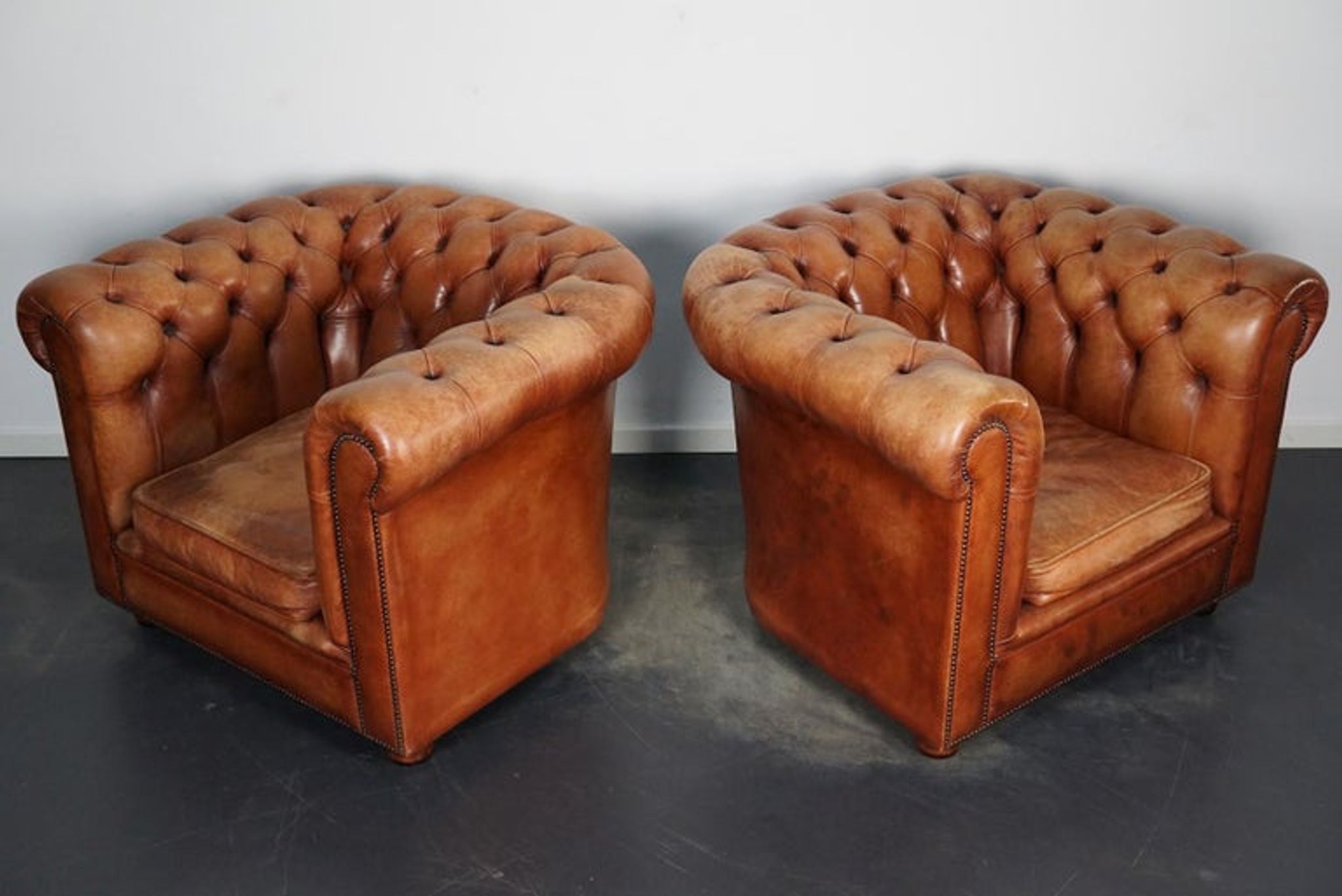 Set of 2 vintage chesterfield club armchairs in cognac leather, Netherlands,