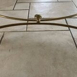 Coffee table in glass and gold metal