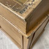 Wooden hardware cabinet painted with wood effect, circa 1940.