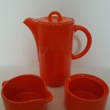 Coffee pot has orange 1970 sugar milk