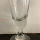 12 old glasses on foot at bistro or absinthe