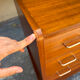 Vintage 1950s small chest of drawers with compass legs.