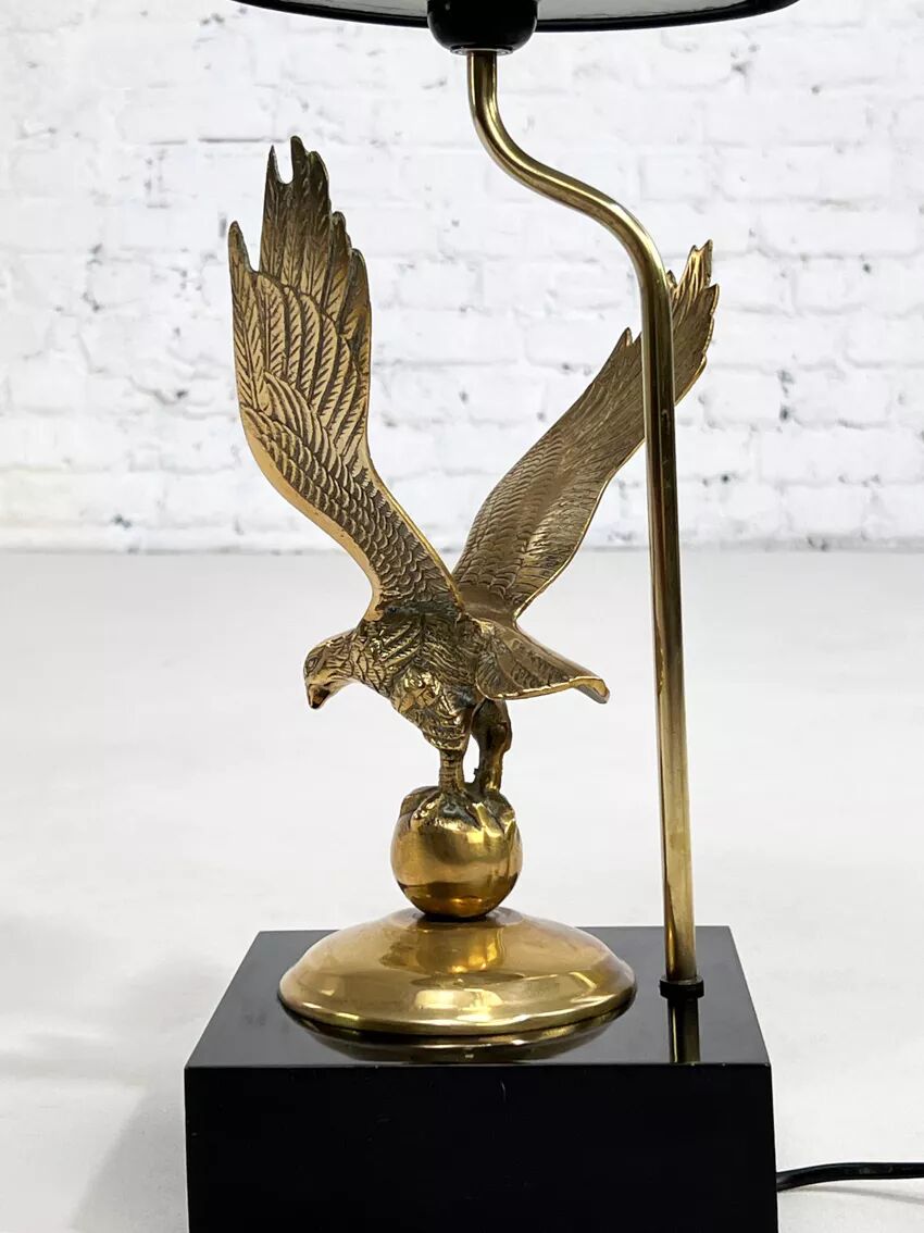 Brass lamp on black lacquered wooden base