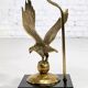 Brass lamp on black lacquered wooden base