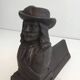 Pair of cast iron andirons in the likeness of a musketeer