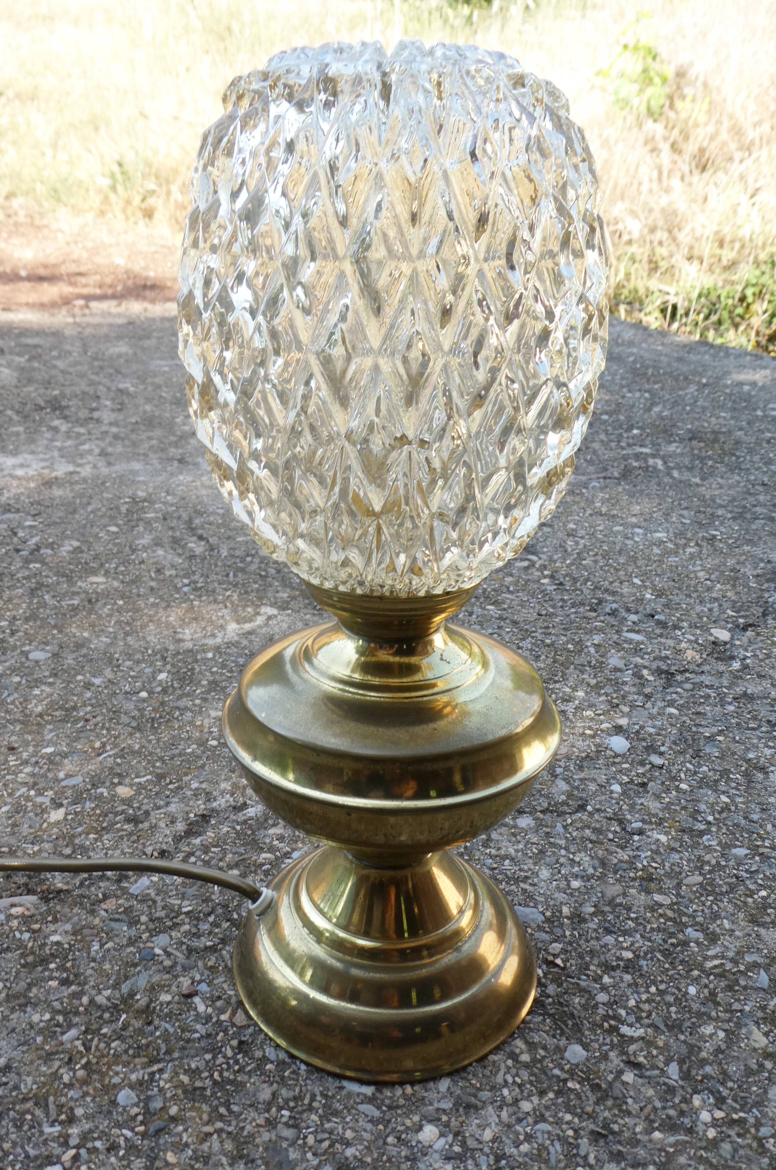 Vintage table lamp with chiseled glass globe.