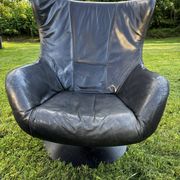 Egg chair style armchair and its ottoman.