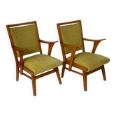 Set of 2 1950s armchairs with green upholstery.