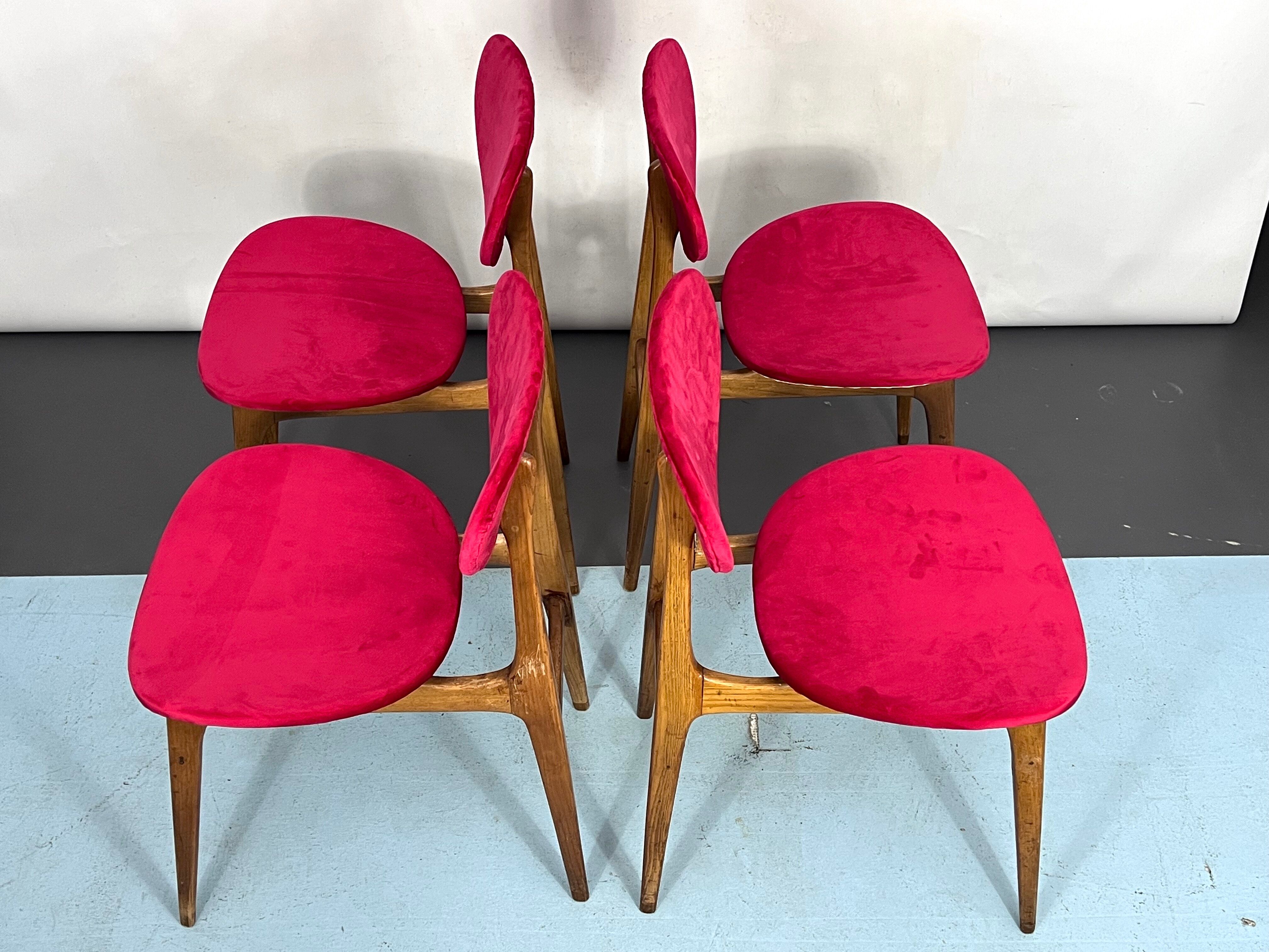 Set of four red velvet and wood dining chairs, Italy 1950