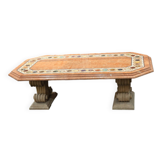 Table composed of a carved stone base with marble and hard stone inlay decoration