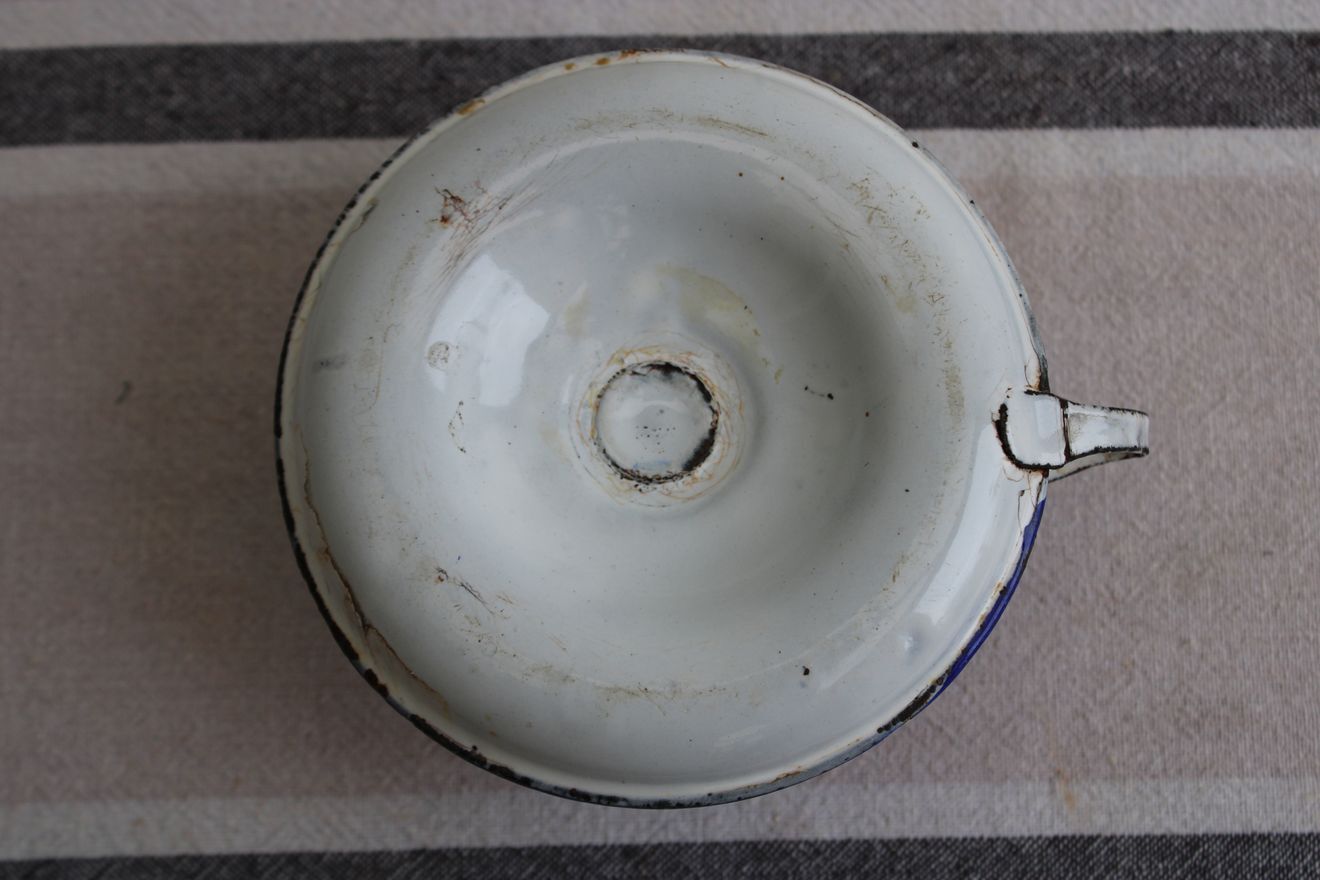 Old enamel candle holder