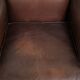 Subtle sheepskin wingback armchair with a deep cognac colour