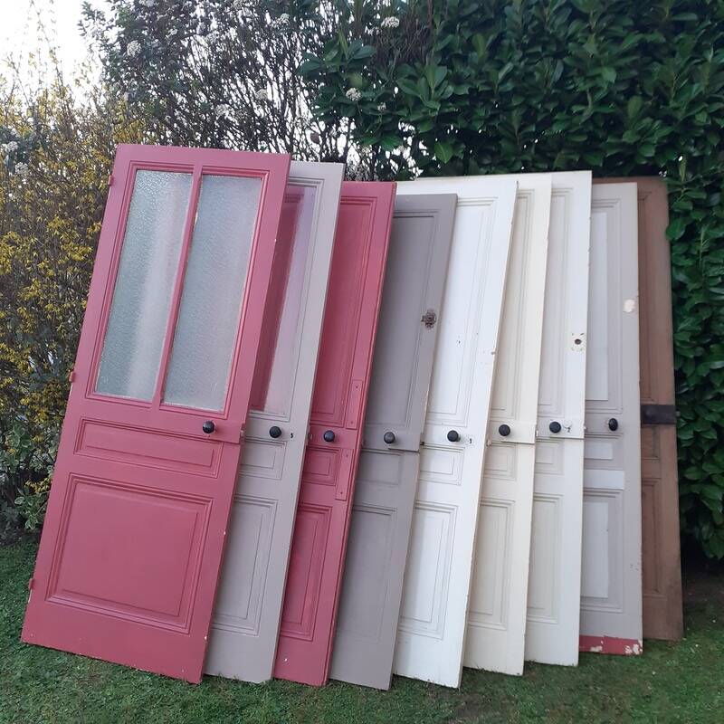 Eight old communication doors, solid and glazed, made of solid wood.