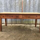 Antique solid cherry farmhouse table with 2 front drawers.