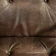 Modern vintage Danish armchair in beech and brown leather by Farstrup Møbler, 1970.