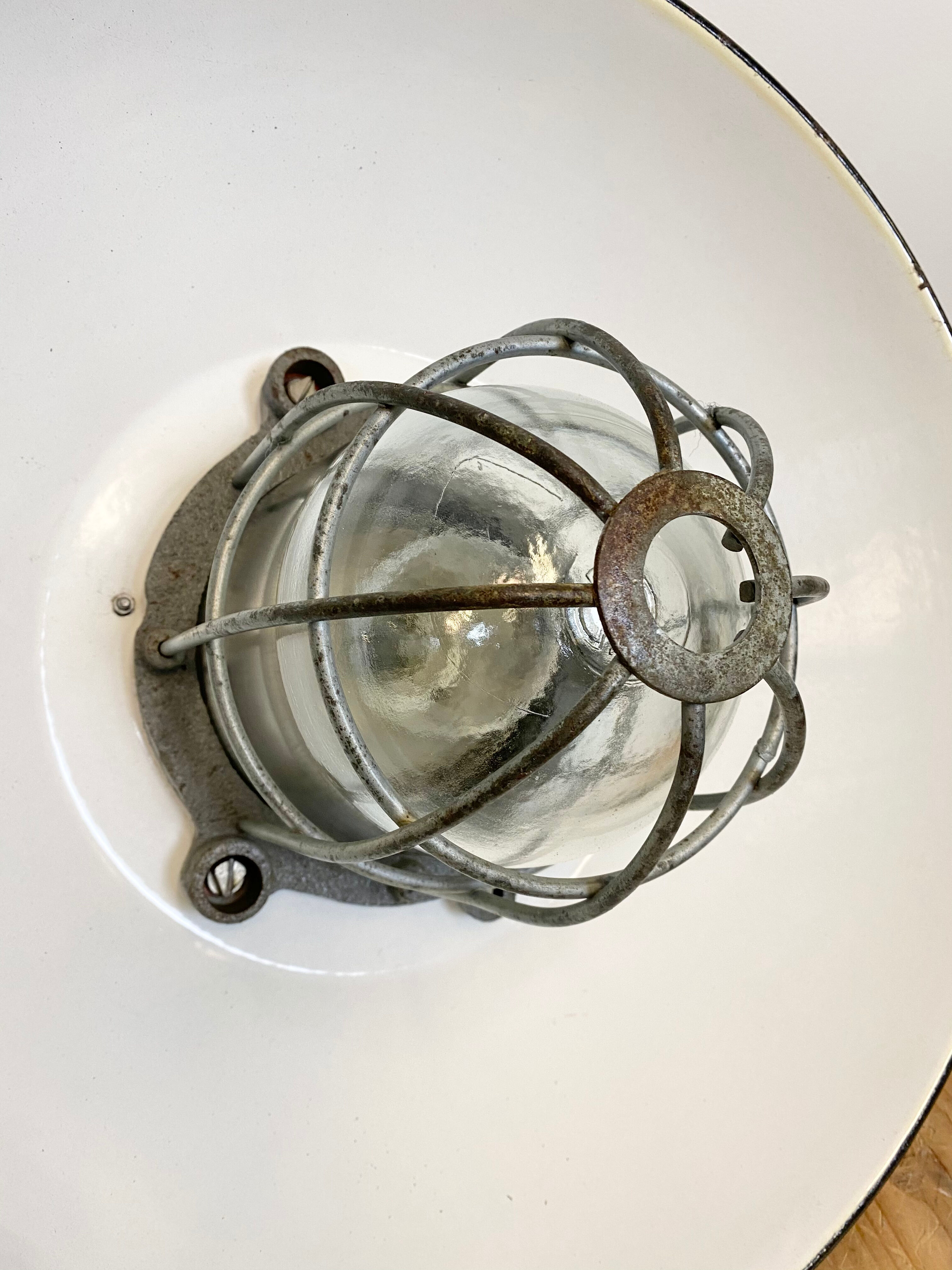 Black enamel and cast iron industrial cage pendant light , 1950s