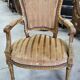 Paire de fauteuils en bois dore style Louis XVl