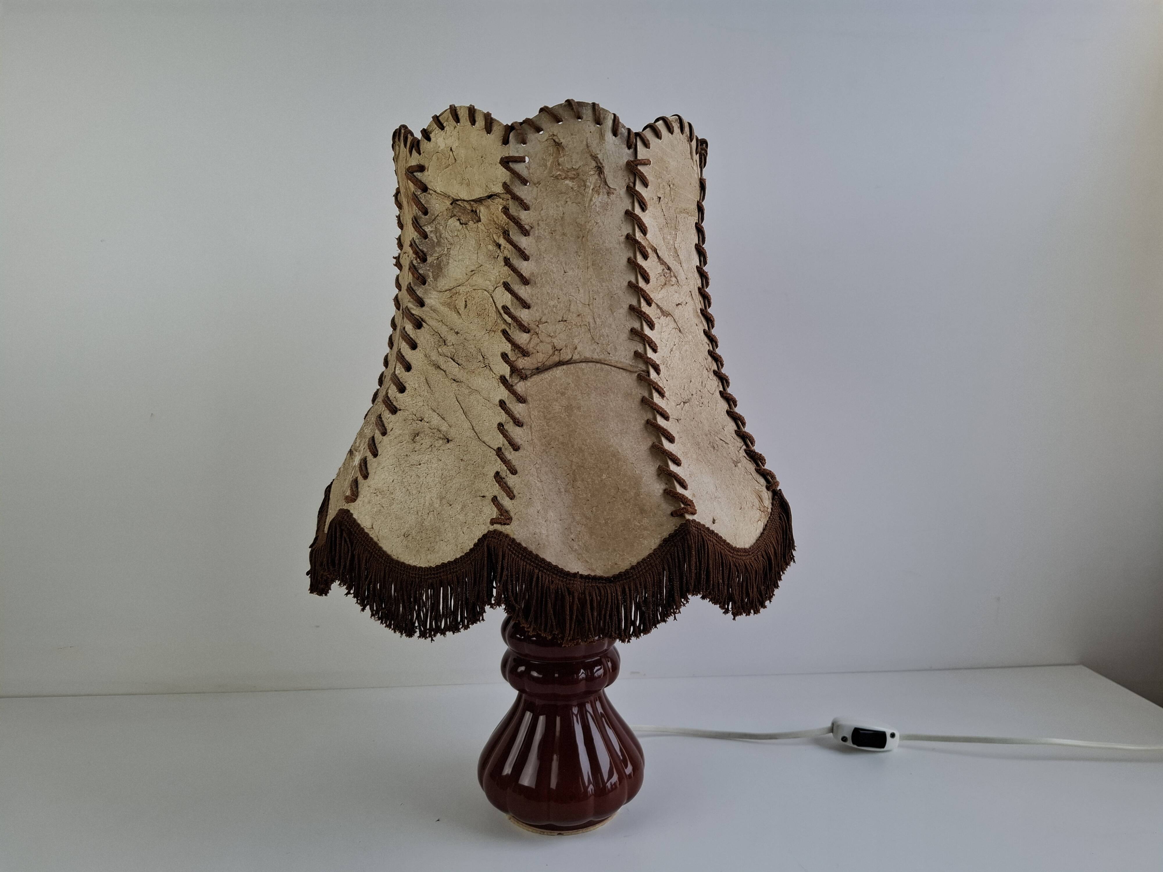 Vintage ceramic table lamp with hand-stitched leather shade, 1980s.