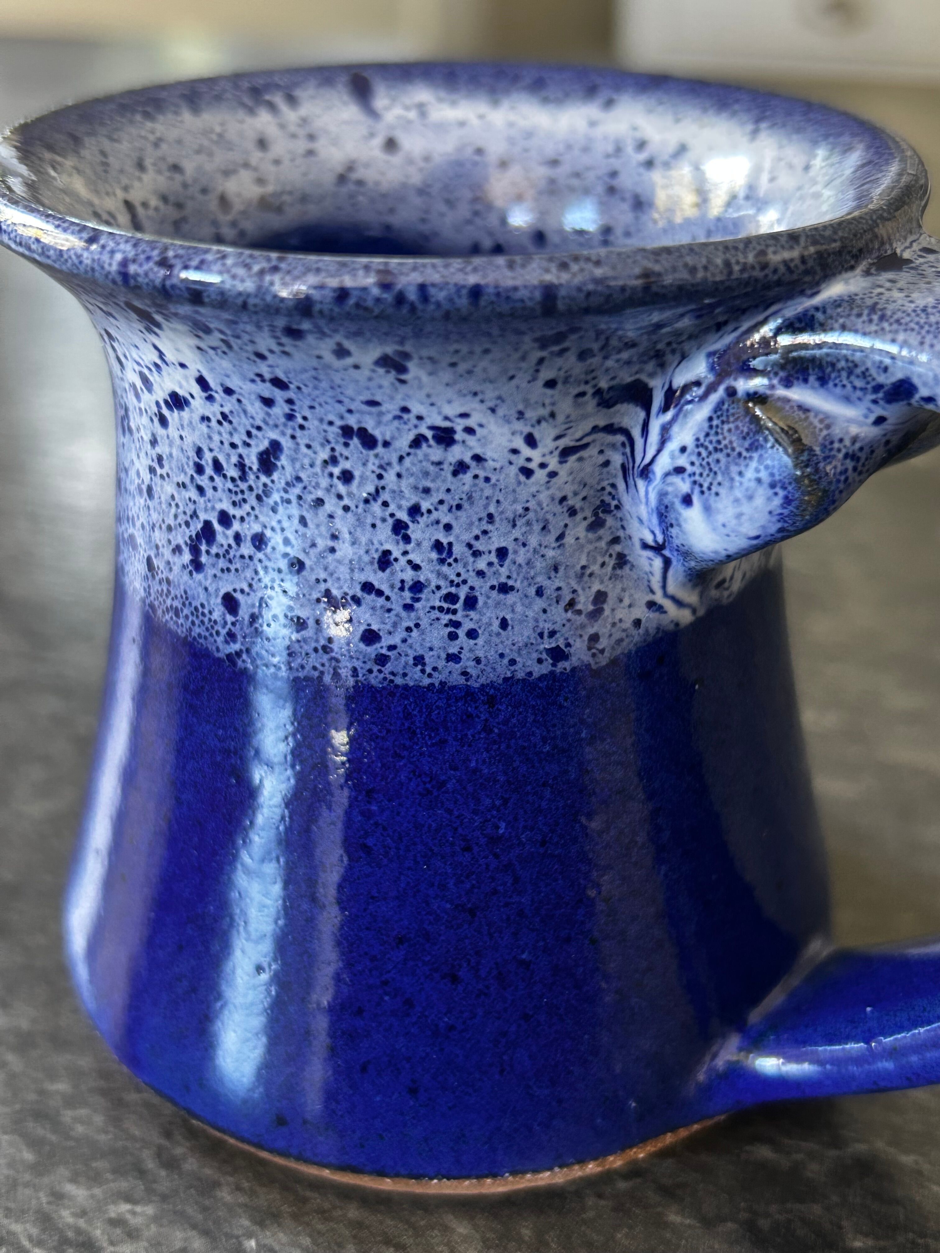 Small enamelled earthenware milk jug