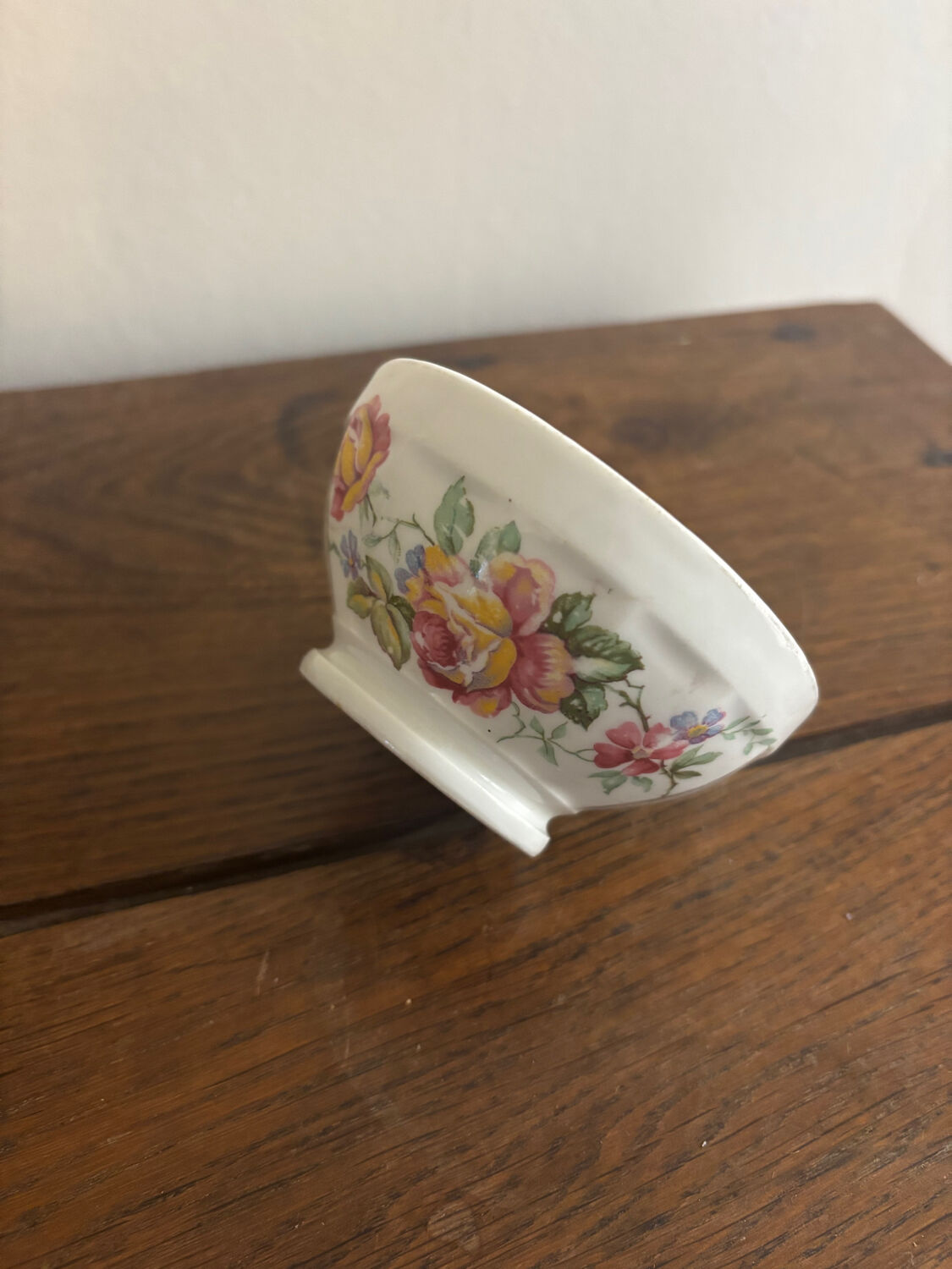 Vintage small antique bowl with floral decoration.