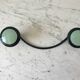 Design coat hook in sage green and black metal from the 70s