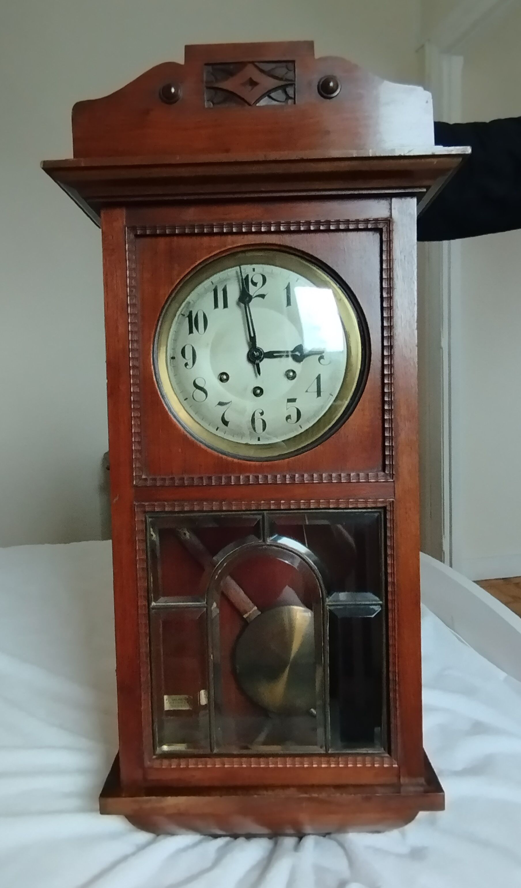 Wooden clock with beveled glass