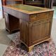 English flat desk with drawers from the 1970s in fir and leather top.