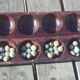 Traditional carved wooden Awalé game Mancala