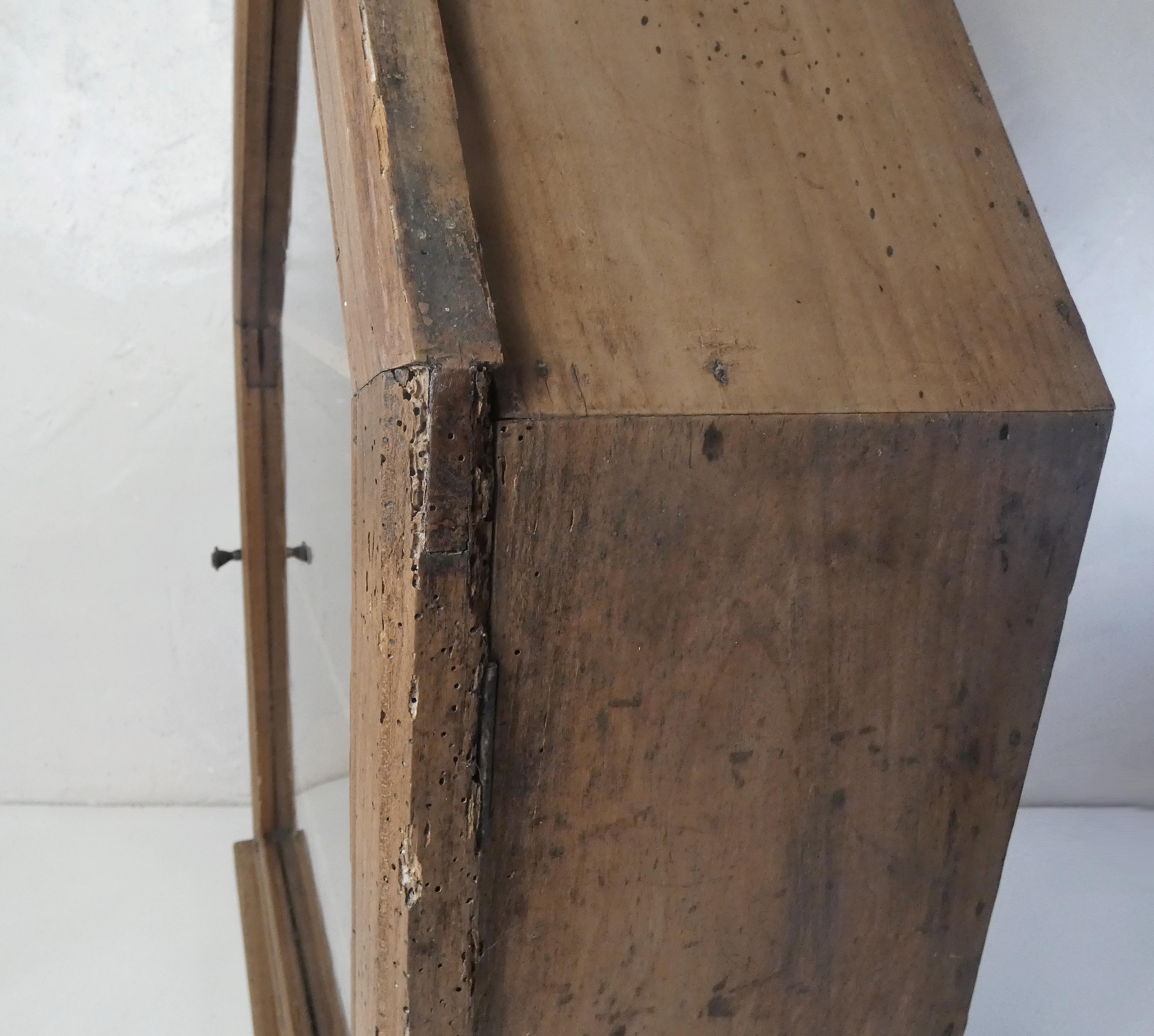 Old niche shelf with glazed statue