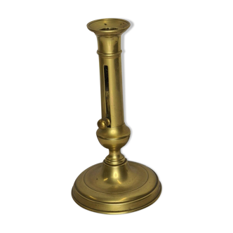 Candle holder with brass pusher