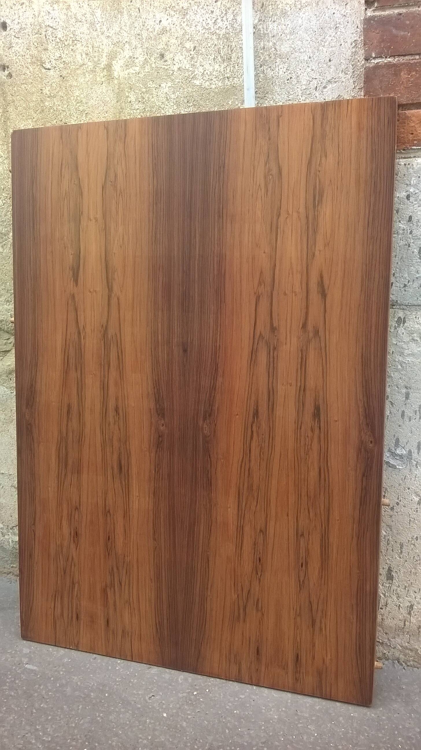 Extendable teak dining table
